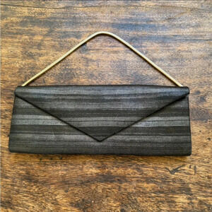 Giorgio Armani leather clutch with magnetic closure. Interior: silk. Never worn.